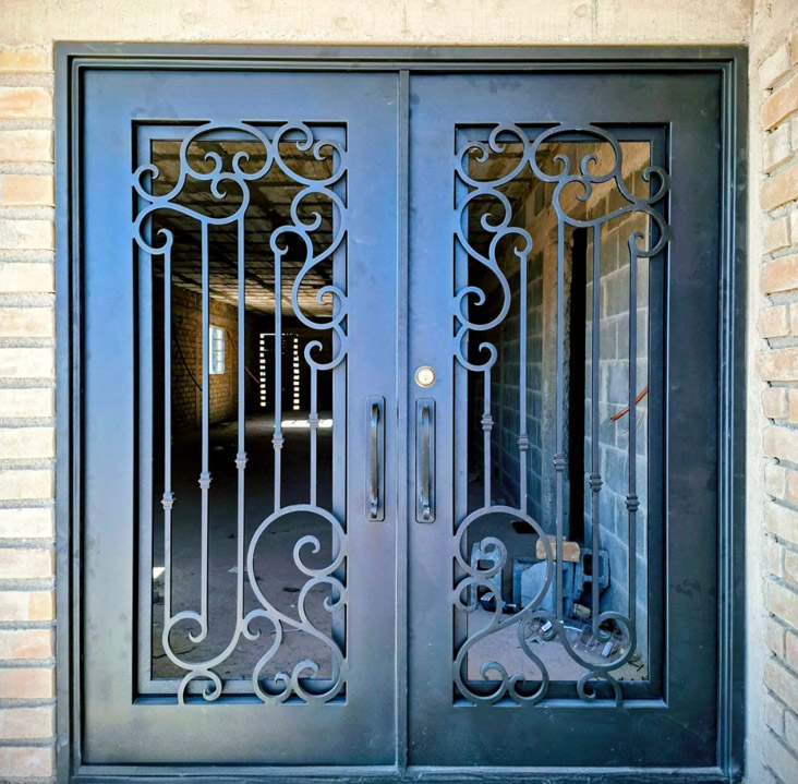 Traditional ornamental iron double door with scrollwork Texas