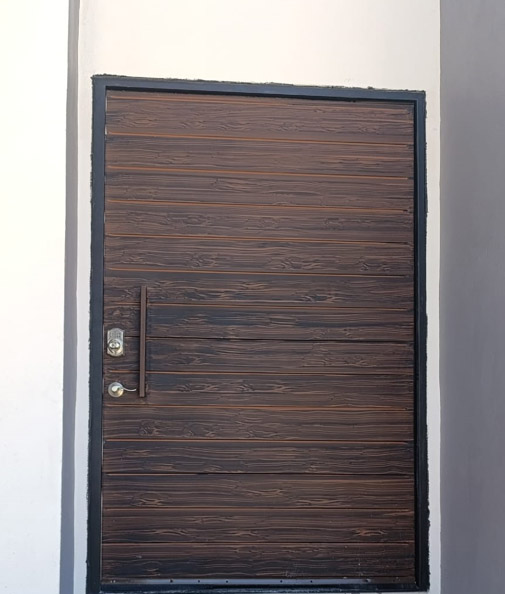 Wood finish steel door horizontal slat pattern Texas