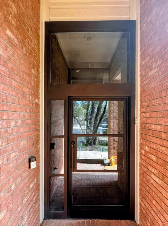French grid iron double door Texas limestone surround
